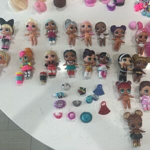 (19) L.O.L. Surprise! Dolls with accessories and carrying case